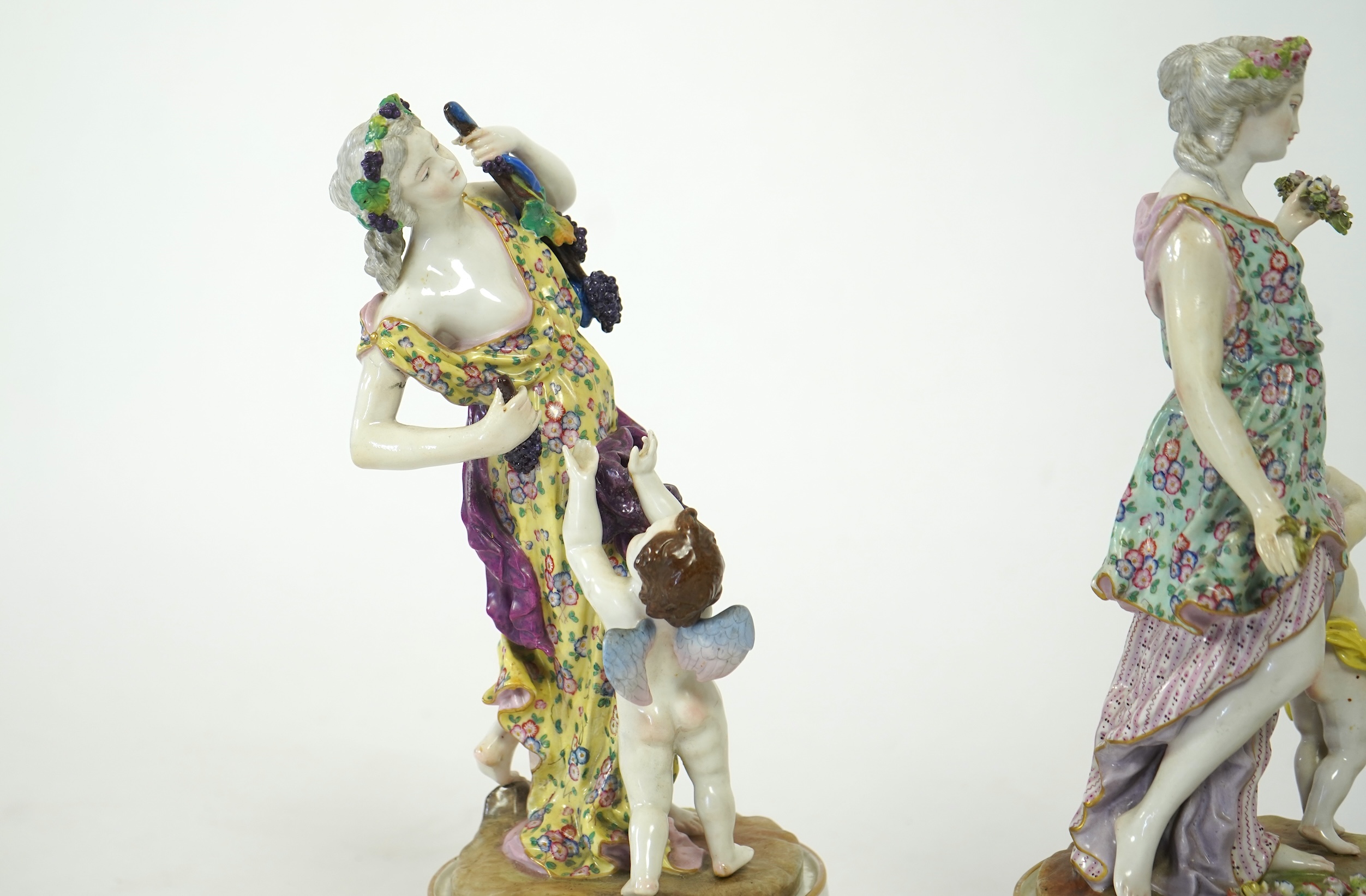 A set of four large Meissen style 'Four Seasons' groups and separate pedestals